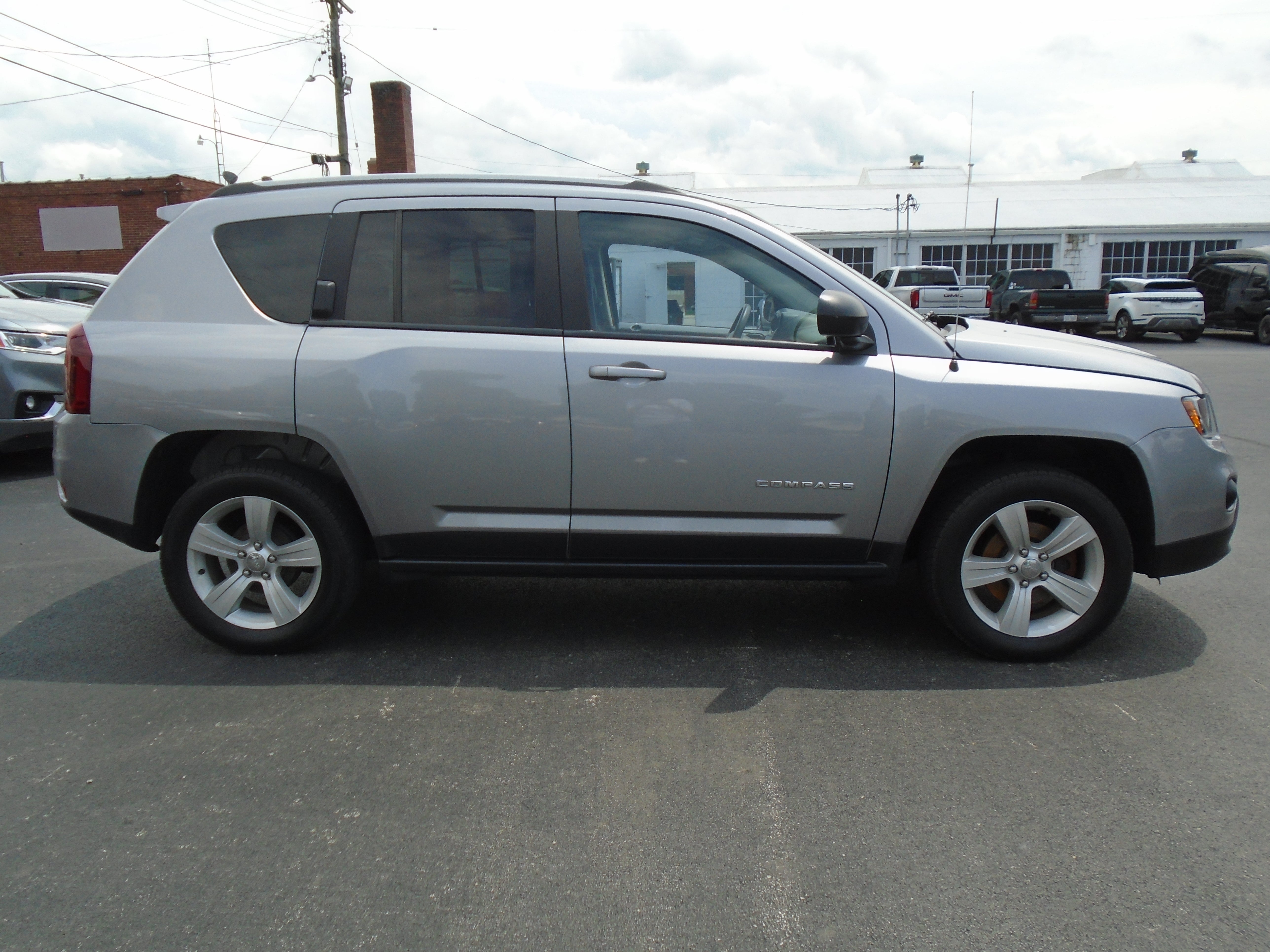 2016 Jeep Compass Sport in Silver — front three-quarter view