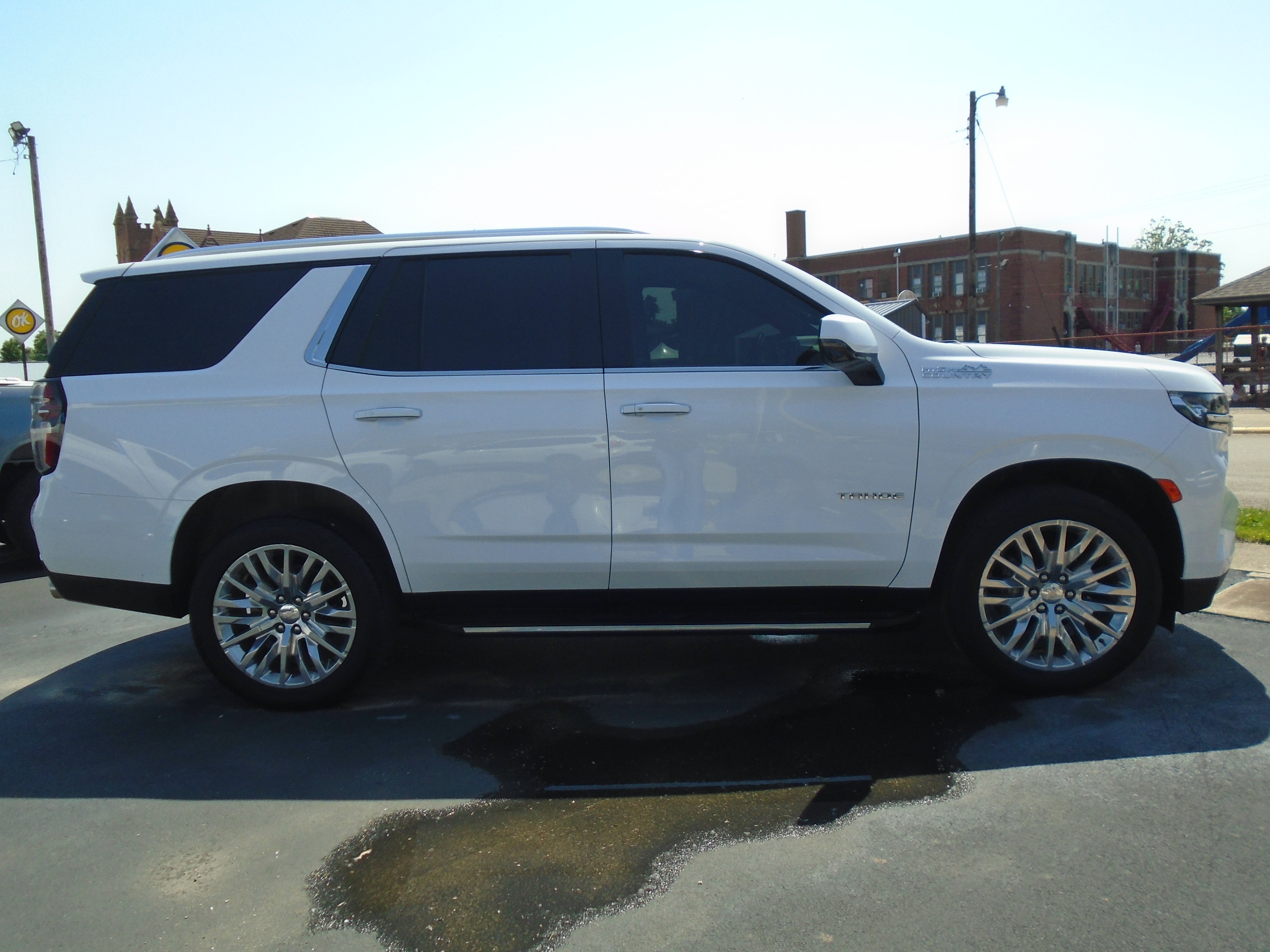2024 Chevrolet Tahoe High Country in Summit White — front three-quarter view