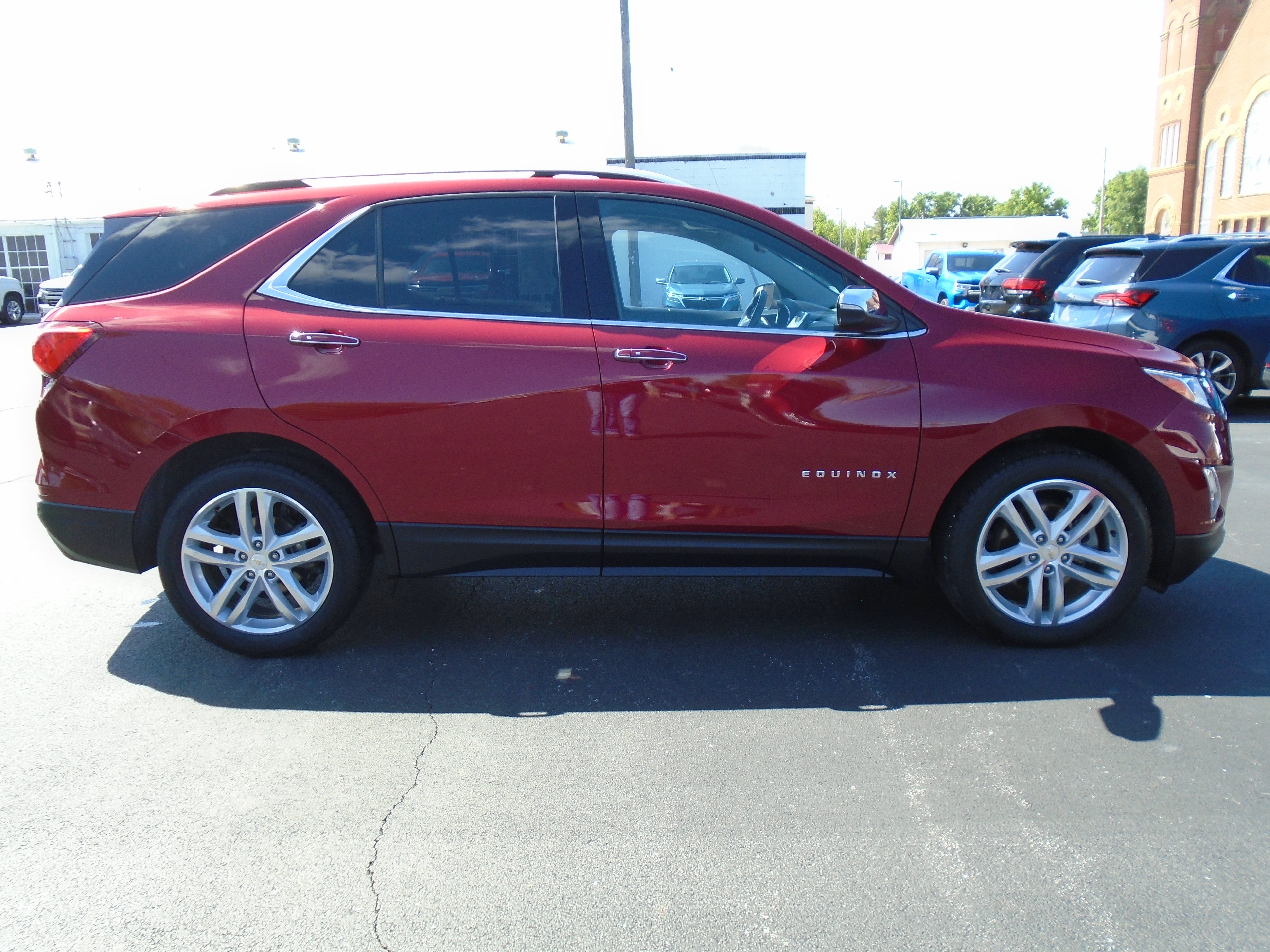2019 Chevrolet Equinox Premier in Cajun Red Tintcoat — front three-quarter view