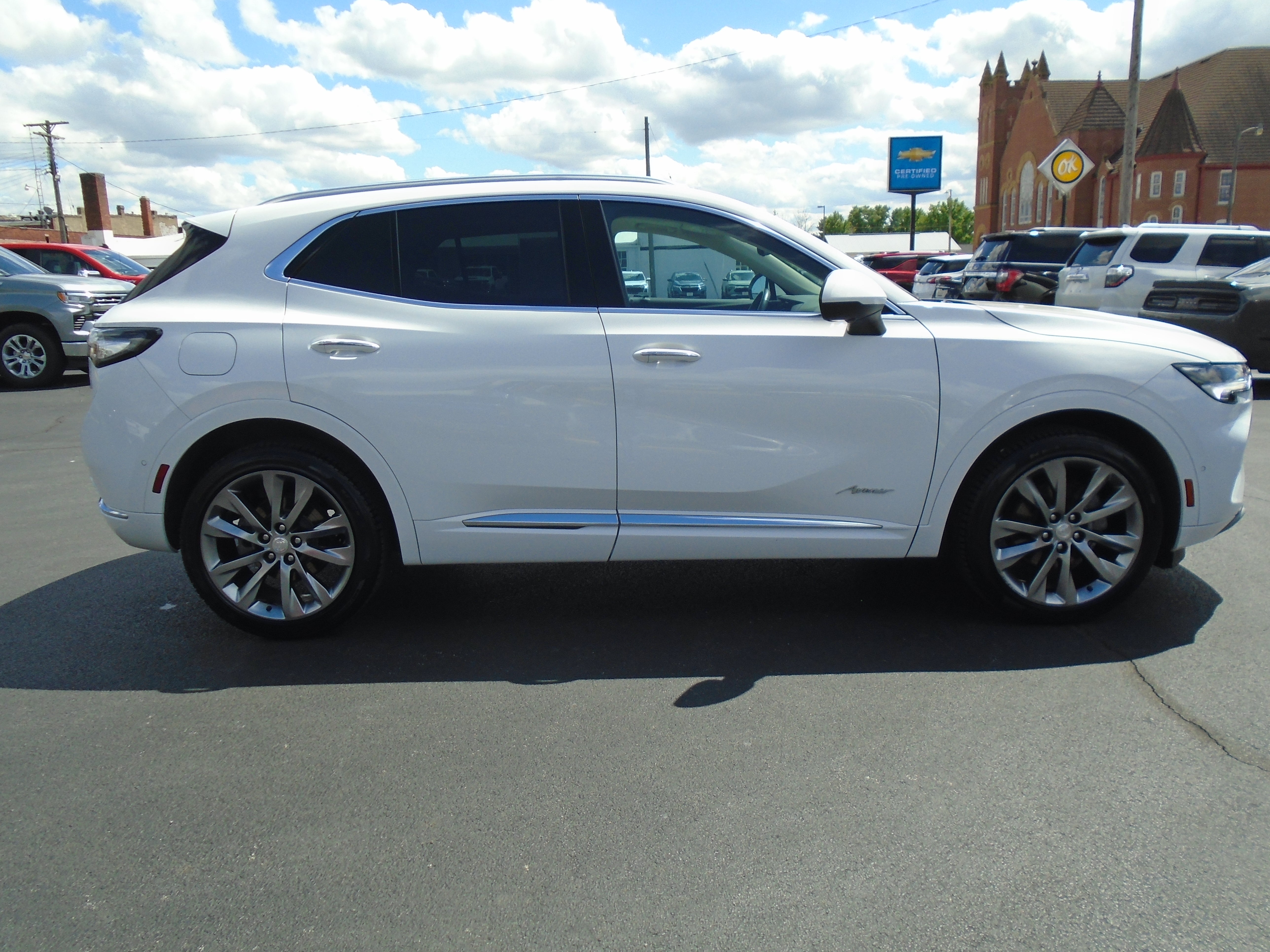 2021 Buick Envision Avenir in Summit White — front three-quarter view
